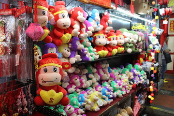 Chinese new year monkey soft toys on display in a street market