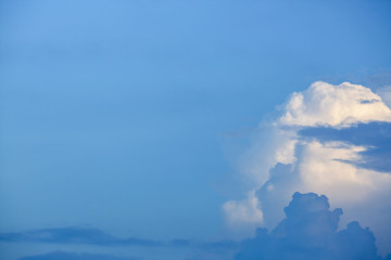 sunlight through fluffy white cloud on clear blue sky background