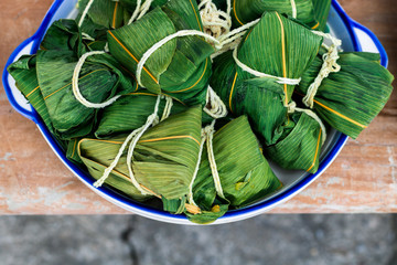 Chinese rice dumplings (zongzi) wrapped in bamboo leaves.