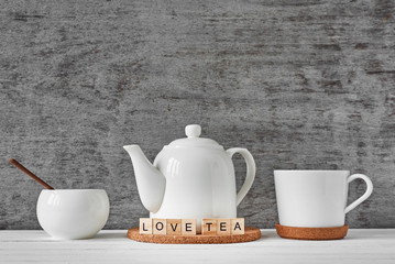 Cup of tea, teapot and sugar bowl