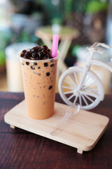 Ice bubble milk tea in takeaway glass.