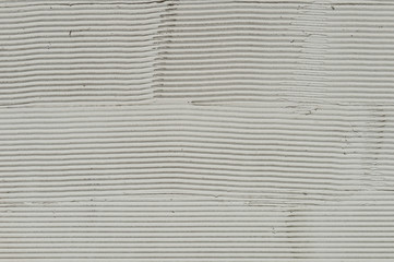 Naklejka premium Fragment of a wall with scratches and cracks. White cement background with patterns.