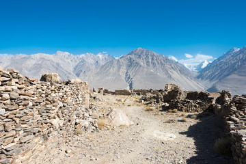 Pamir Mountains, Tajikistan - Aug 22 2018: Ruins of Yamchun Fort in the Wakhan Valley in Gorno-Badakhshan, Tajikistan. It is located in the Tajikistan and Afghanistan border.