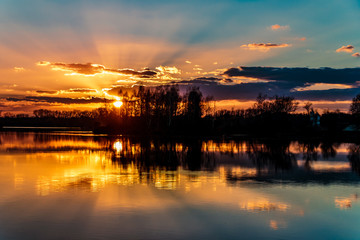Fototapeta premium Beautiful sunset with reflections near Ettling-Isar-Bavaria-Germany