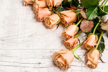 Big bouquet of roses on wooden background