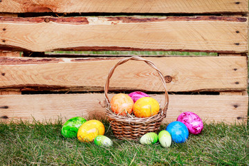 Traditional Easter basket with colorful eggs.