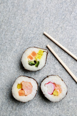 Sushi set on grey stone background.