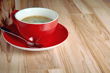 cup of coffee on wooden table