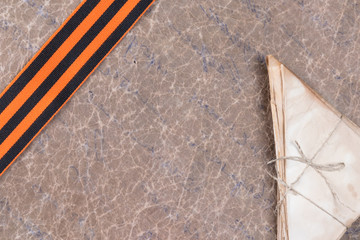 orange ribbon of St. George in the left corner and a military letter on a blank old sheet of paper, in the center there is a place for your inscription