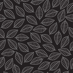Vector seamless pattern with white leaves silhouettes on a black background