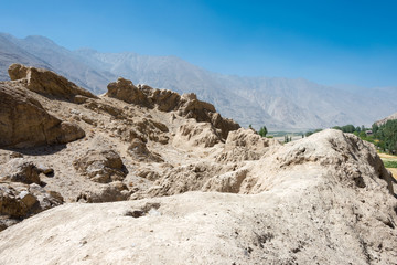 Ishkashim, Tajikistan - Aug 23 2018: Ruins of Khaakha Fortress in the Wakhan Valley in Ishkashim, Gorno-Badakhshan, Tajikistan. It is located in the Tajikistan and Afghanistan border.