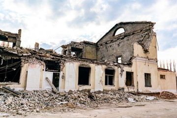 destroyed ruined house in the war and bricks laying around b