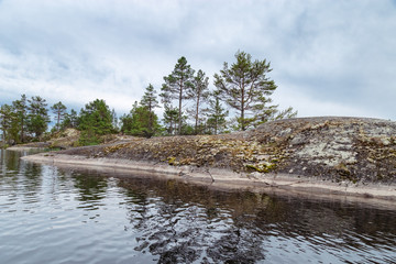 Lake Ladoga. Republic Of Karelia, Russia. Archipelago type of coast. Landscape on Ladoga. Rocky shores of lake. Ecologically clean nature.