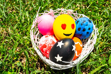 colored Easter eggs on the grass