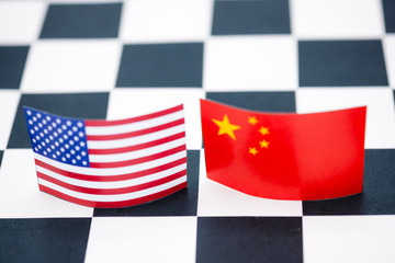 USA and China flags  on chess table . Its is symbol for tariff trade war crisis or unfair business...