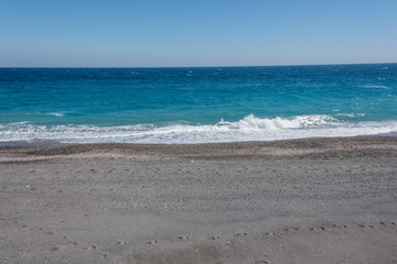 Waves Washing Ashore on a Black Sand Volcanic Beach in Sicily