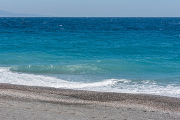 Waves Washing Ashore on a Black Sand Volcanic Beach in Sicily