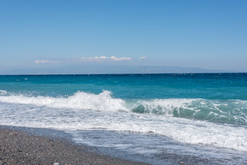 Waves Washing Ashore on a Black Sand Volcanic Beach in Sicily
