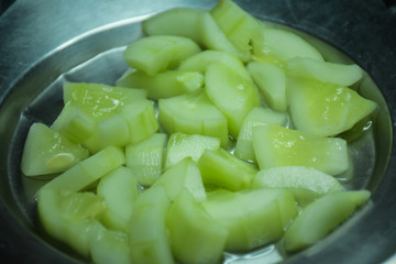 green cucumber in bowl