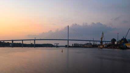Fototapeta premium The large Rügen bridge from Stralsund to the island of Rügen in the early morning in the haze