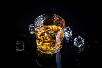 Whisky, whiskey or bourbon with ice