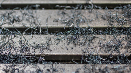 Steel shavings on a milling machine.