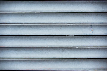Blinds painted in blue paint