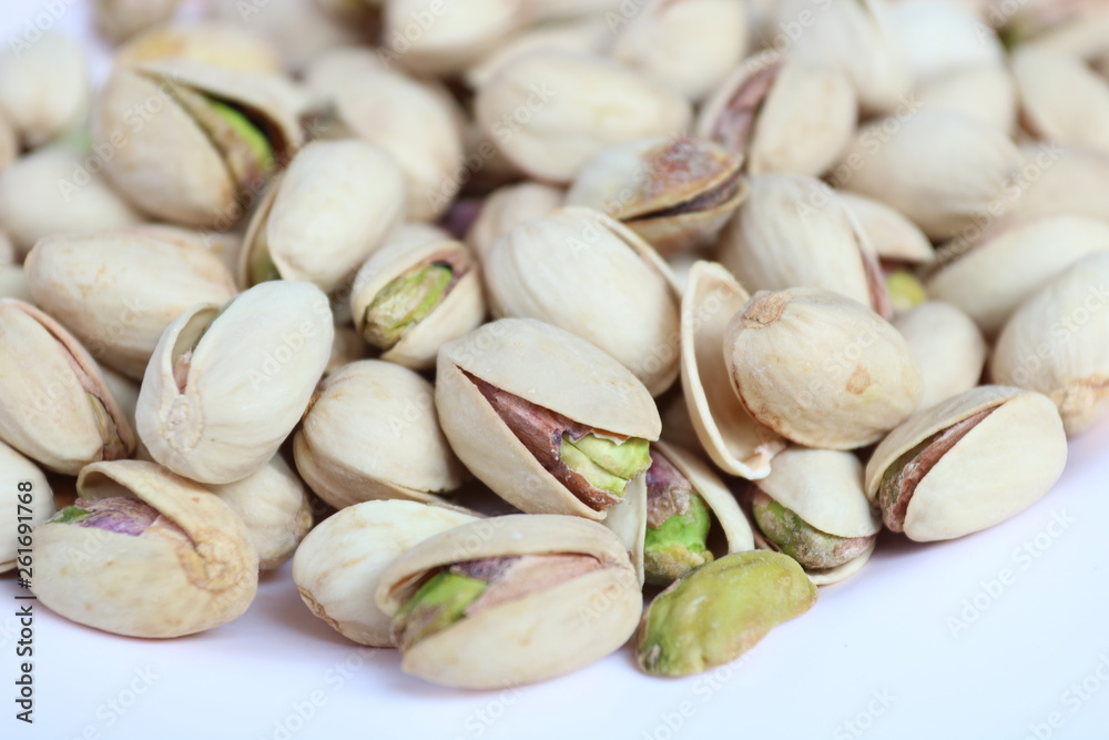 Wall mural pistachios on white background