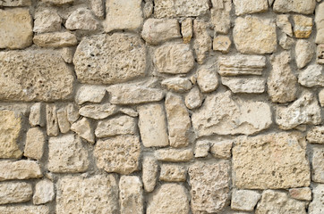 Old relief limestone wall closeup