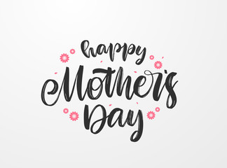 Handwritten brush type lettering composition of Happy Mother's Day with flowers on paper background.