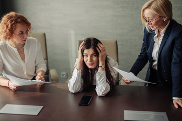 Young female office manager unable to cope with too many tasks from her boss and supervisor,...