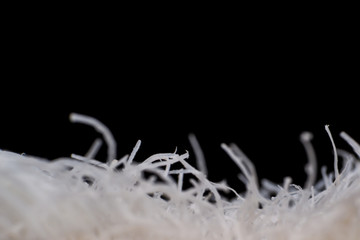 worn toothbrush closeup on black background