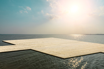 Naklejka na ściany i meble Wooden floor platform and blue sea with sky background