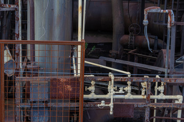 Background of industrial pipes anf grids, paint and metal patinas, horizontal aspect