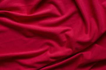 Fototapeta na wymiar Close up of beautiful wrinkle carmine pink fabric texture