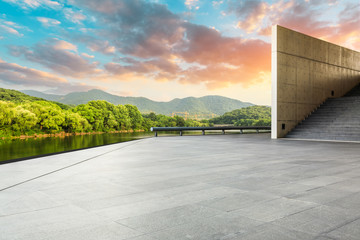 Empty square floor and green mountain with sky clouds landscape