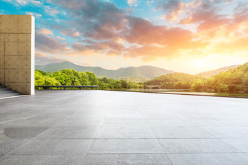 Empty square floor and green mountain with sky clouds landscape