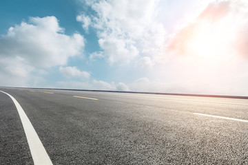Empty asphalt road ground and blue sky with white clouds scene