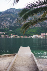 Small lighthouse on the pier in the city of Kotor, Montenegro.