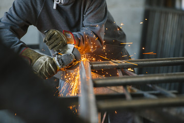 A worker with a welding machine works