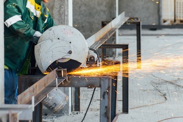 A worker with a welding machine works