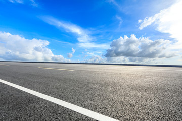 Empty asphalt road ground and blue sky with white clouds scene