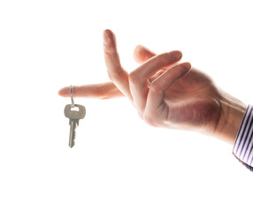 Keys in hand isolated on white