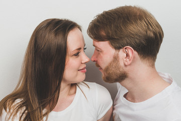 Happy Young Couple Facing Each Other