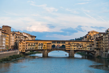 Obraz premium Ponte Vecchio bridge and architecture along river Arno in Florence, Tuscany, Italy
