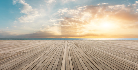 Wooden floor platform and blue sea with sky background - Powered by Adobe