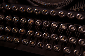 Vintage antique collectible typewriters close-up. Russian keyboards.