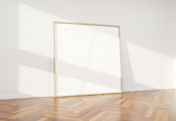 Fototapeta premium Wooden frame leaning in bright white interior with wooden floor mockup 3D rendering