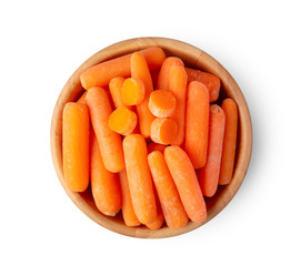 Top view of a group of organic small baby carrots in wood bowl isolated on a white background