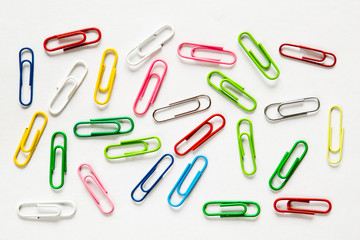 Top view mix colorful paper clips on white background.